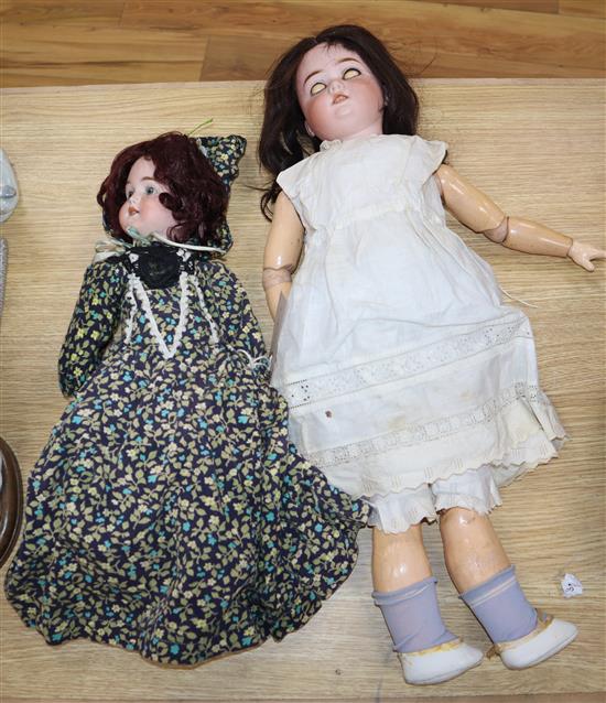 Two Schonau Wolfmeister bisque head dolls, one 20, one 16